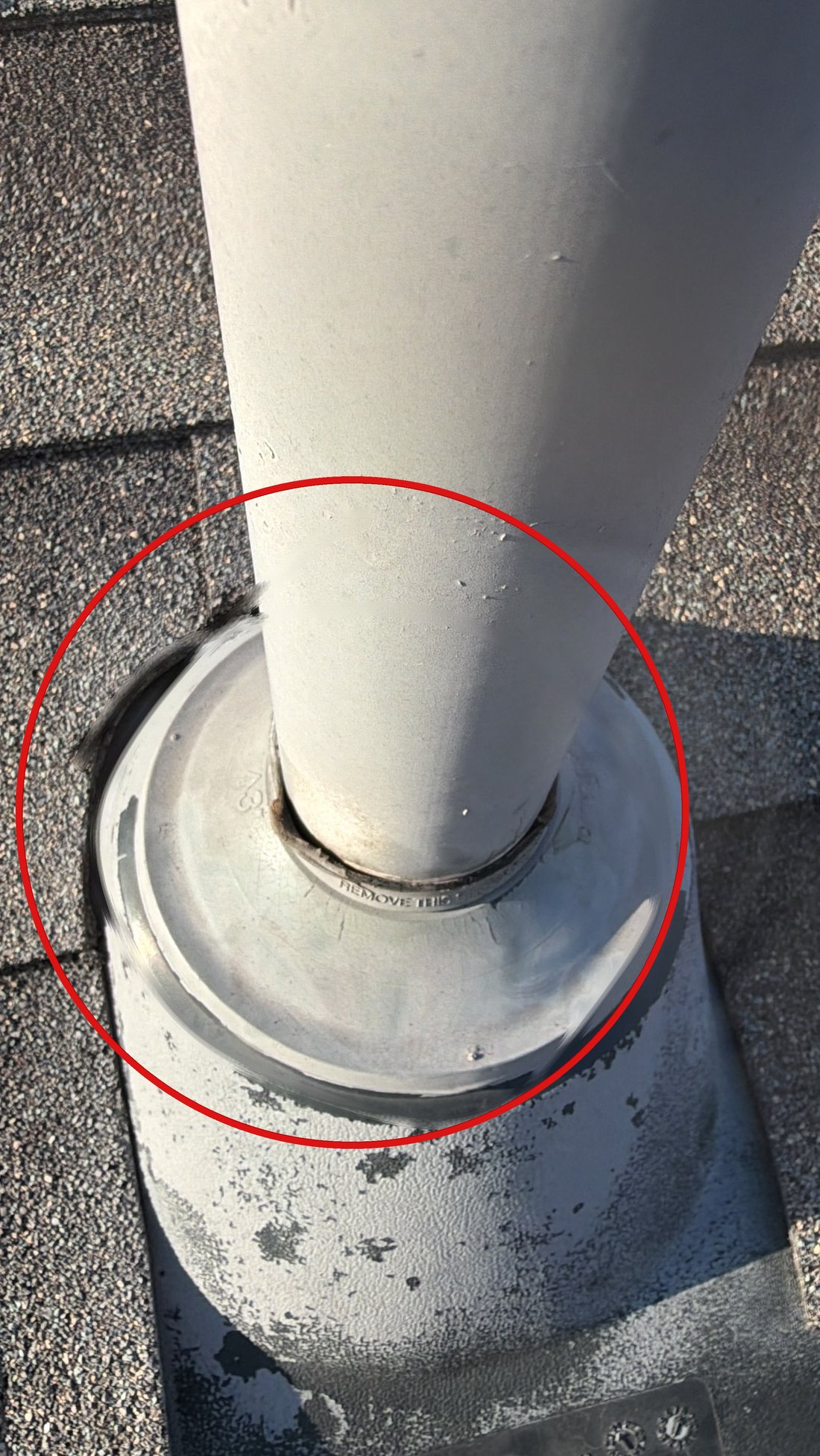 Failed pipe boot with circled damage at the collar