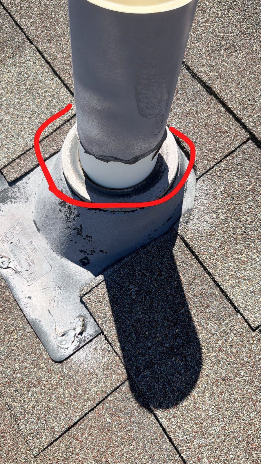 Plastic pipe boot with a membrane collar highlighted by a red circle
