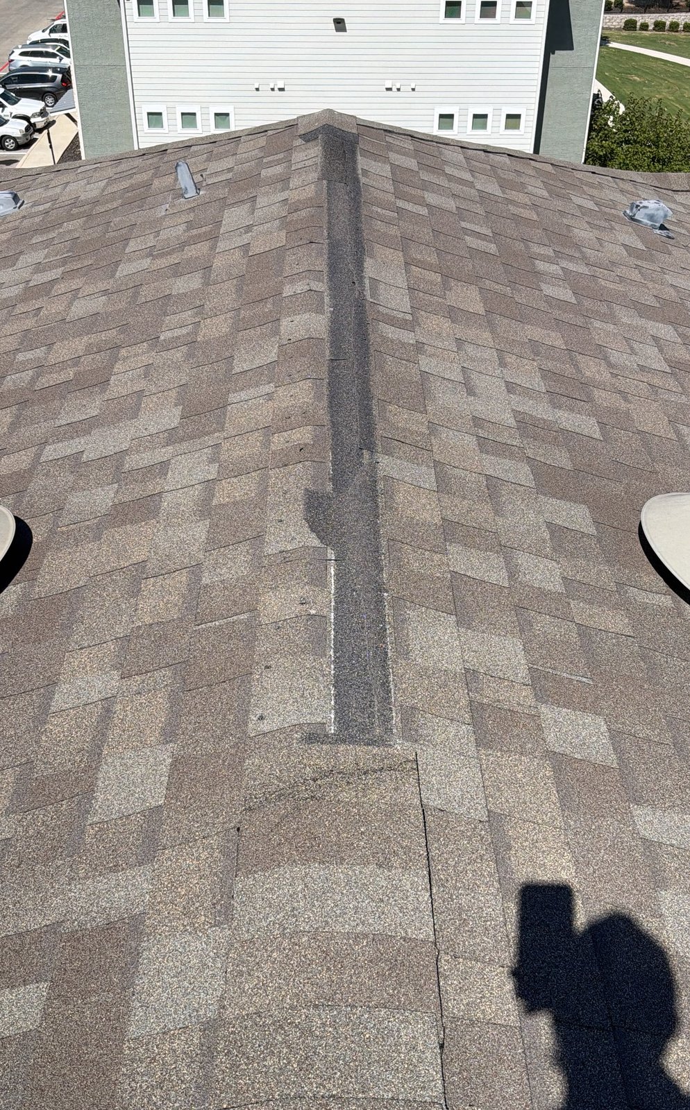 Ridge with a long stretch of missing ridge cap