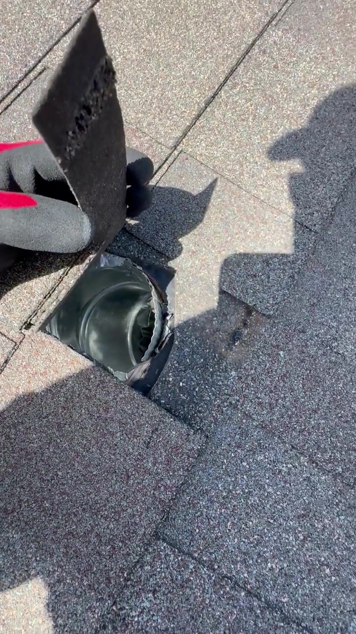 Flap lifted showing open metal duct with missing vent cap